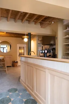 a large kitchen with a bar in a house at Made in Catherine in Brussels