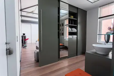 a bathroom with a sink and a mirror at Les Lofts d'Artistes in Brussels