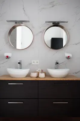 two sinks in a bathroom with two mirrors at Les Lofts d'Artistes in Brussels