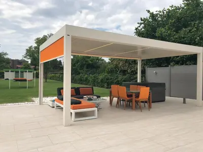 a pavilion with chairs and a table and a table at B&B Carpe Diem in Westerlo