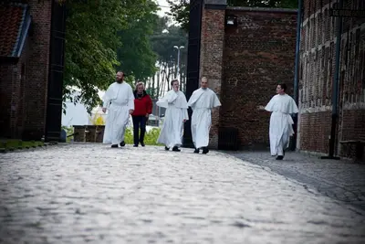 a group of priests walking down a street at B&B Carpe Diem in Westerlo