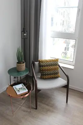 a living room with a chair and a table at CITYSTAY in Antwerp