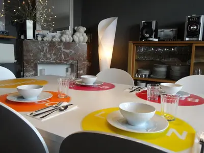 a dining room table with plates and bowls on it at B&B Welcome To My Place in Brussels
