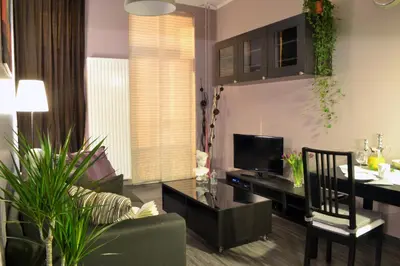a living room with a couch and a table at Appartbrussels in Brussels