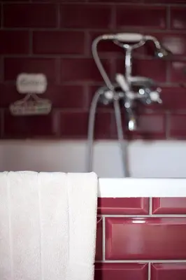 a group of towels on a bathroom counter with a shower at Boutique hotel Roosendaelhof in Geel