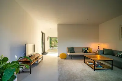 a living room with a couch and a table at VELPE 55 in Bierbeek