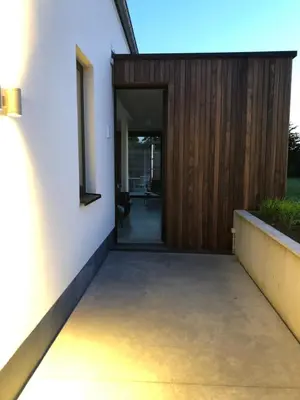 a hallway of a house with a wooden door at ma-tinée in Beauvechain