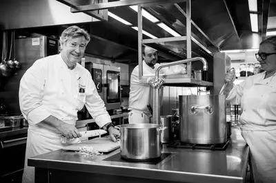 a group of chefs in a kitchen preparing food at Hotel Geerts in Westerlo