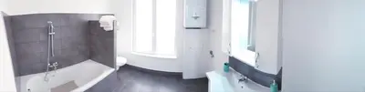a bathroom with a tub and a toilet and a sink at Brussels appartments luxury in Brussels