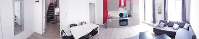 a living room with a couch and a table at Brussels appartments luxury in Brussels