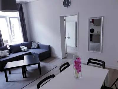a living room with a couch and a table at Brussels appartments luxury in Brussels
