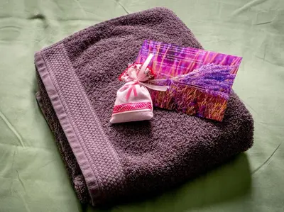 a pink towel with a pair of shoes on it at Quartier Leonard in Ghent