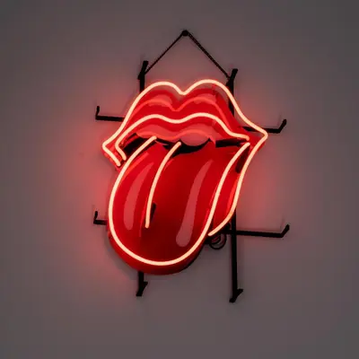 a neon sign of the rolling stones tongue at Quartier Leonard in Ghent