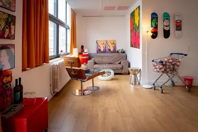 a living room with a couch and a table at Quartier Leonard in Ghent