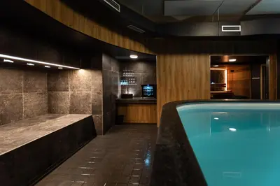 a room with a swimming pool and a kitchen at Hotel Orion in Ghent