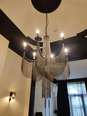 a chandelier hanging from the ceiling in a room at B in Antwerp in Antwerp