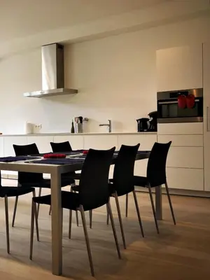 a dining room table and chairs in a kitchen at Bed & Boon in Ghent