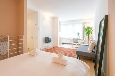 a bedroom with a bed and a living room at Theaterstudio 1 Antwerp in Antwerp