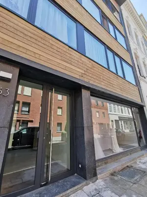 a store front with glass windows on a city street at Theaterstudio 1 Antwerp in Antwerp