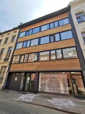a building on a street with a store window at Theaterstudio 1 Antwerp in Antwerp