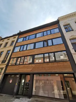 a building with glass windows on the side of it at Theaterstudio 1 Antwerp in Antwerp