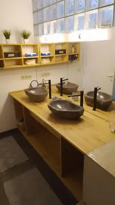 two sinks on a wooden counter in a room at Land Scape guesthouse in Eeklo