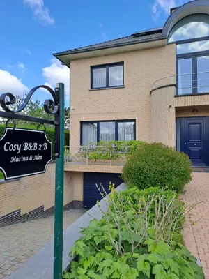 a house with a sign in front of it at COSY B&B 2B in Overijse