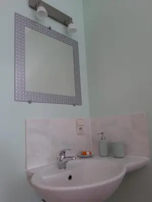 a bathroom with a sink and a mirror at COSY B&B 2B in Overijse