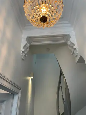 a chandelier hanging from a ceiling in a room at Holiday Home Jules in Antwerp