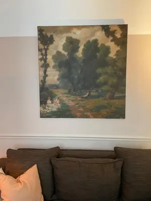 a painting above a couch in a living room at Holiday Home Jules in Antwerp