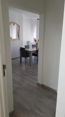 a dining room with a table and chairs at Modern Apartment Second Floor in Brussels