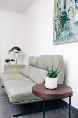 a living room with a couch and a table at Gadering in Zele