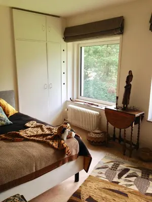 a bedroom with a bed and a window at B+B GOLF SCHILDE in Schilde
