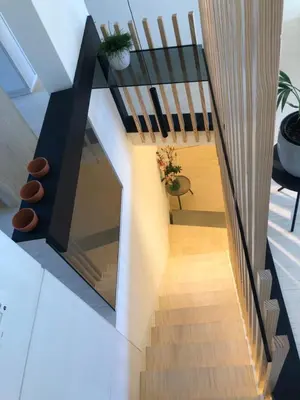 a staircase in a house with a glass ceiling at Desk Till Dawn in Ghent