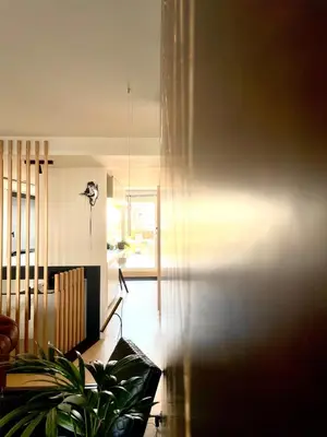 a living room with a couch and a plant at Desk Till Dawn in Ghent