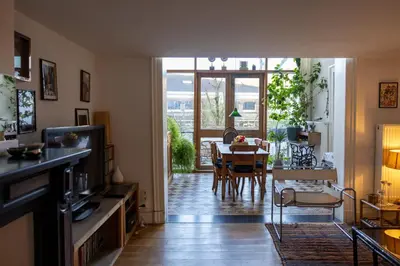 a living room with a table and a dining room at Heaven in Antwerp in Antwerp