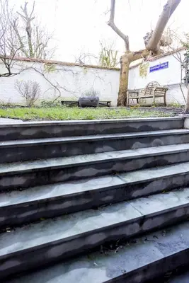 a set of stairs with a bench in a park at Heaven in Antwerp in Antwerp
