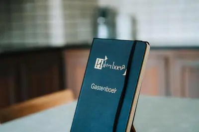 a book sitting on top of a table at De Holsterhoeve in Beringen