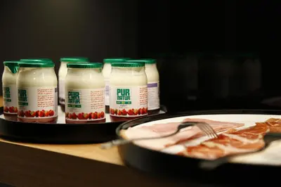 a group of bottles of milk and a plate of pizza at B&B AubergInn in Tessenderlo