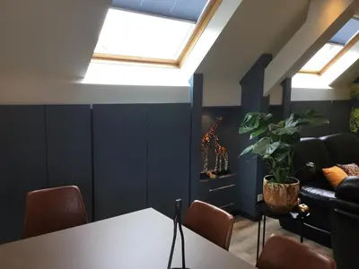 a room with a table and a couch at Gesloten in Geraardsbergen