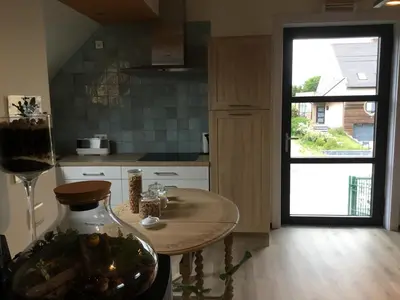a kitchen with a table and a large window at Gesloten in Geraardsbergen