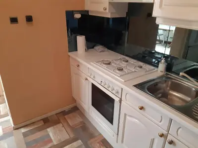 a kitchen with a stove and a sink at CASA DI MARCO in Antwerp