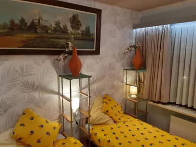 a bedroom with a bed and two vases on shelves at CASA DI MARCO in Antwerp