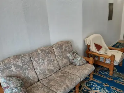 a living room with a couch and a chair at CASA DI MARCO in Antwerp
