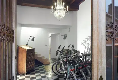 a group of bikes parked in a room with a chandelier at Alphabed & Bike in Ghent