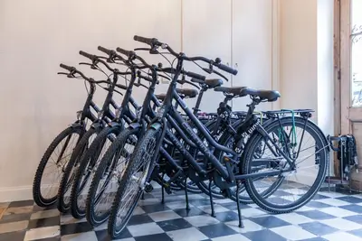 a group of bikes parked in a room at Alphabed & Bike in Ghent
