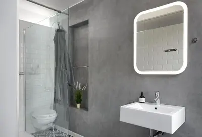 a bathroom with a sink and a toilet and a mirror at Alphabed & Bike in Ghent
