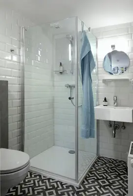 a bathroom with a shower and a toilet and a sink at Alphabed & Bike in Ghent
