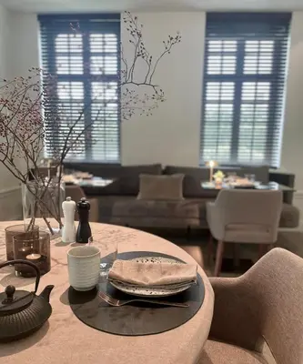 a living room with a table with a plate on it at Relax Select in Munte