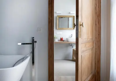 a bathroom with a white tub and a sink at The Greenhouse in Antwerp